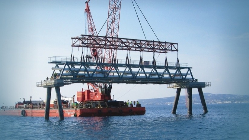 Marteam - Construction of Jetty:Transportation with barges: 47 Trestles, 12 units of Platform & 14 Loading Arms. Lifting & Installing the Trestles onto the circular pile foundations & concrete racks